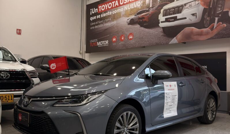 
								COROLLA XEI HV 2024 GRIS CELESTE full									