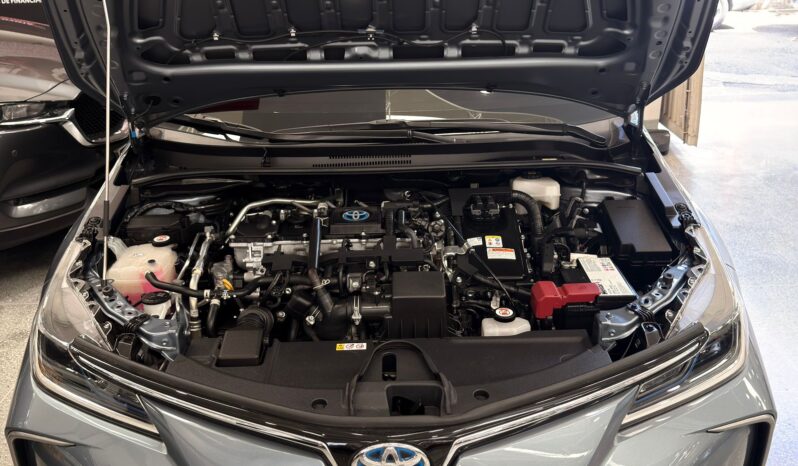 
								COROLLA XEI HV 2024 GRIS CELESTE full									
